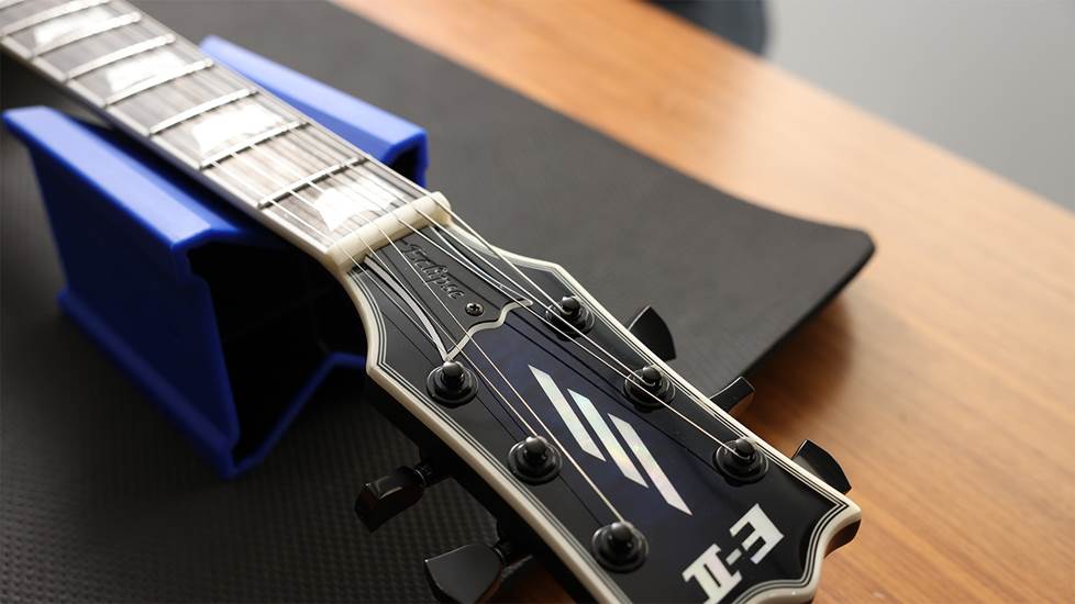 guitar headstock with truss rod cover on