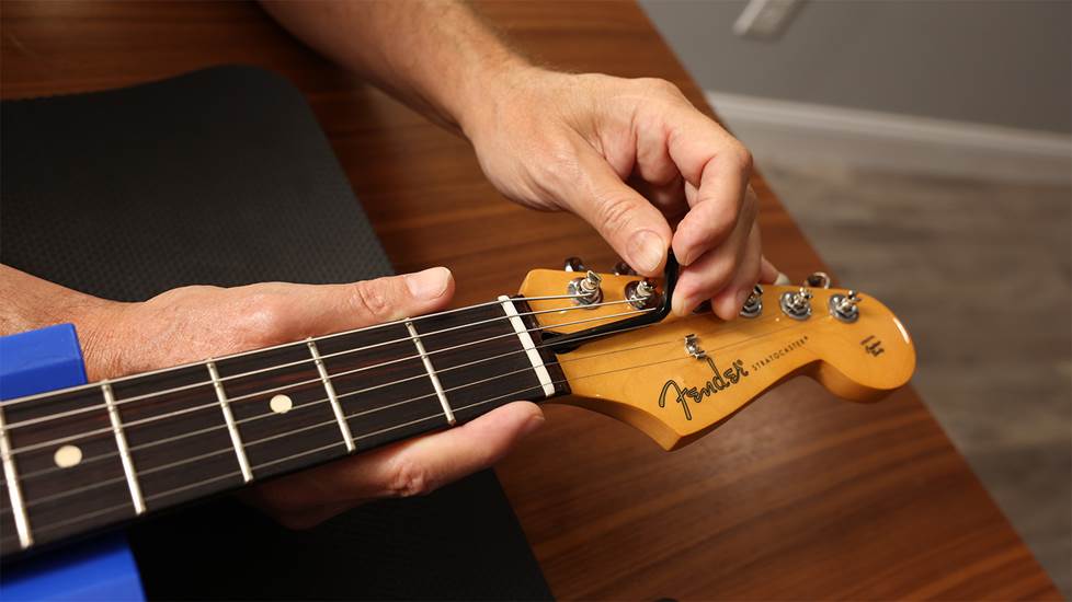 adjusting the truss rod at the headstock