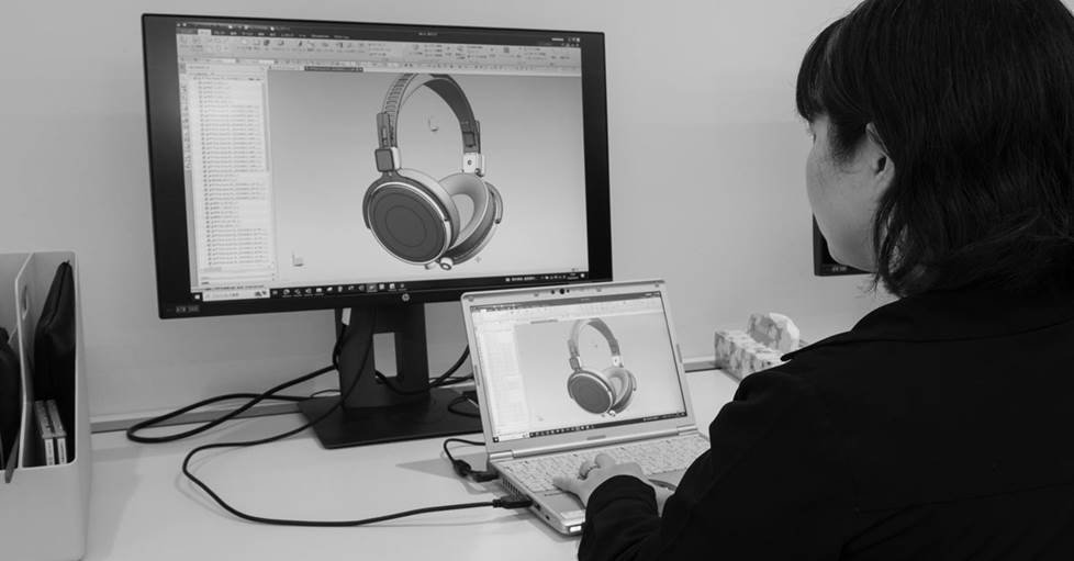 Shiwaku working at her computer