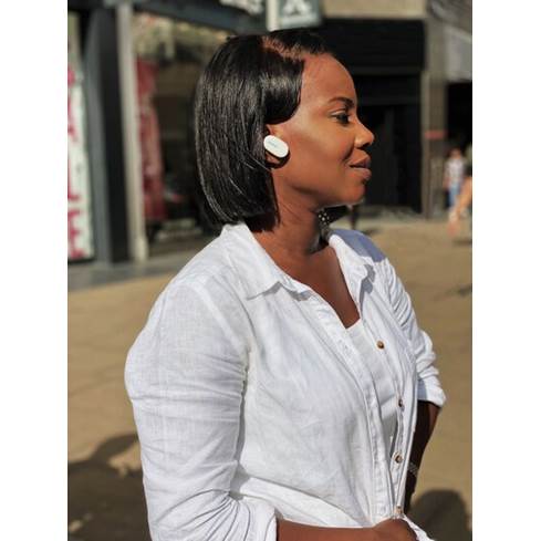 Woman wearing the Bose QC earbuds