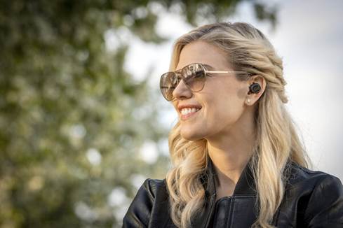 Woman wearing Klipsch T5 True Wireless earbuds