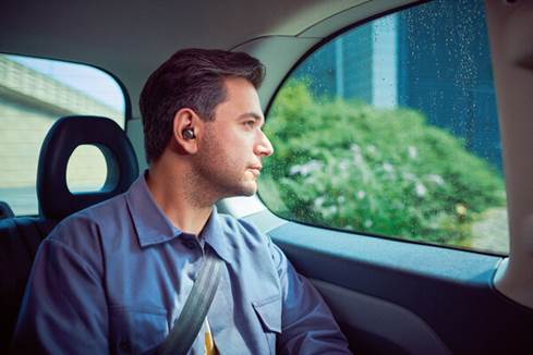 Man wearing PI7 earbuds